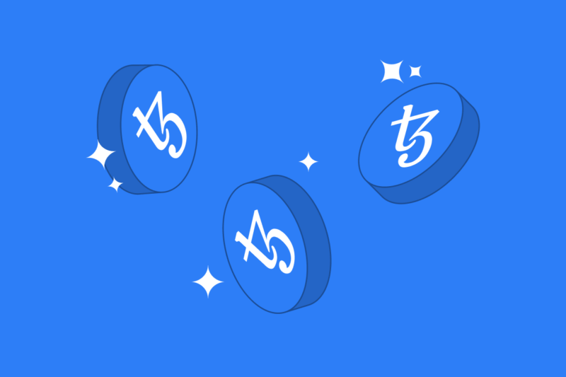 Three Tezos coins floating on a blue background